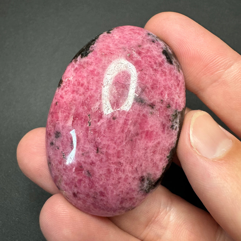 Rhodonite palm stone